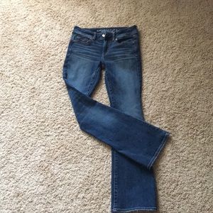 Dark denim jeans, bootcut style